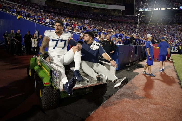 Lewan leaving the field in Buffalo following his injury that ended his 2022 season.